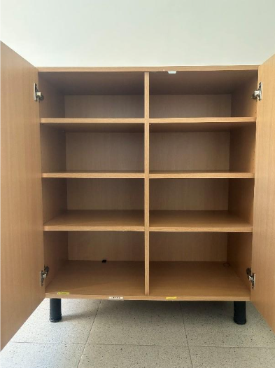 A wooden cabinet with many compartments

AI-generated content may be incorrect.