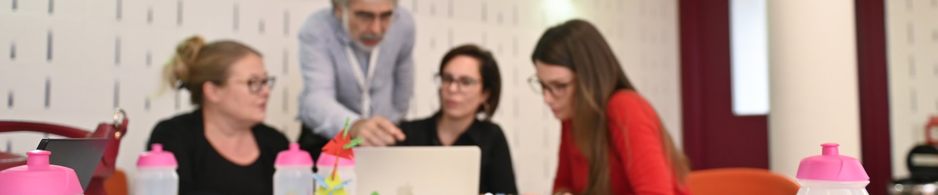 Colleagues discussing innovative educational ideas