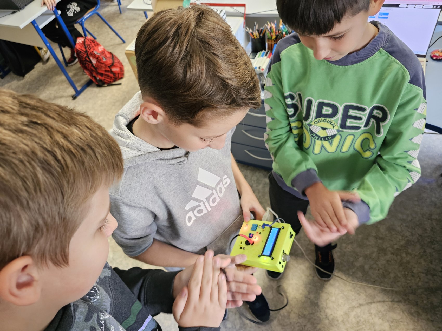Children using the climate education digital tool, P-BIT Mini by POWAR STEAM