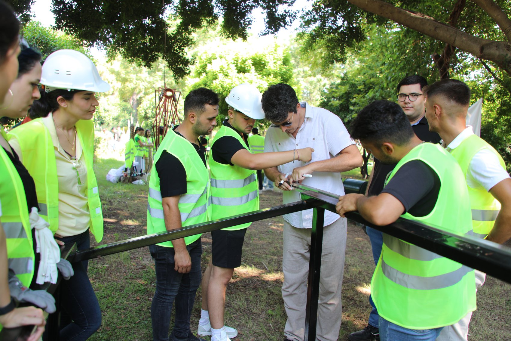 A trainer with a group of students teaching practical aspects of solar engineering