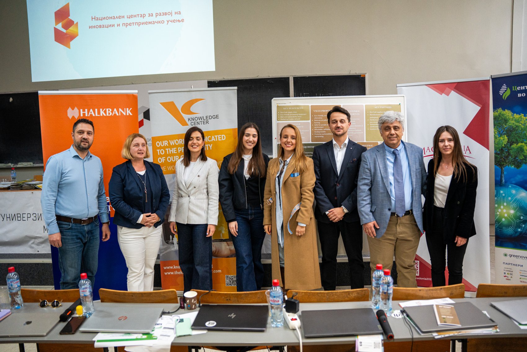 VET teachers and members of the jury evaluating eco-business ideas presented by students at a sustainable innovation competition
