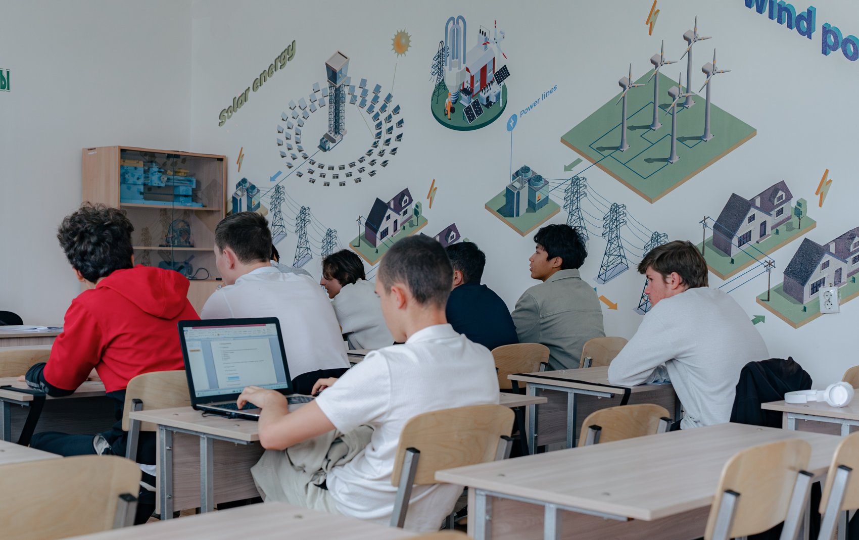 Students in a classroom learning renewable energy skills