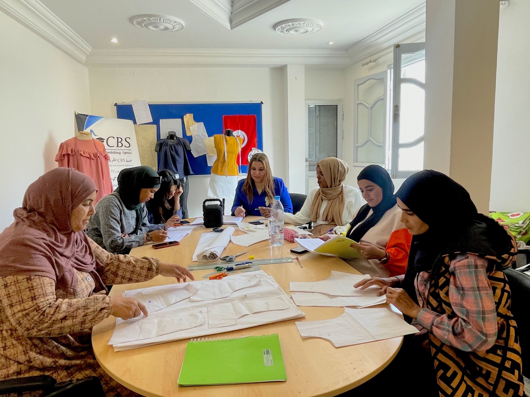 A group of women in Tunisia learning sewing and pattern cutting skills
