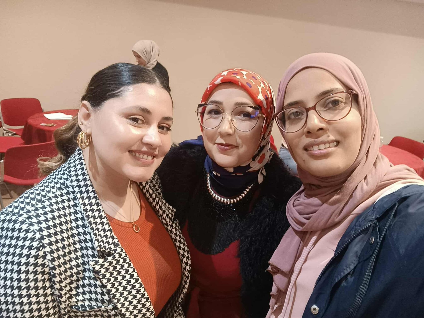 A trainer with two women on a skills development course
