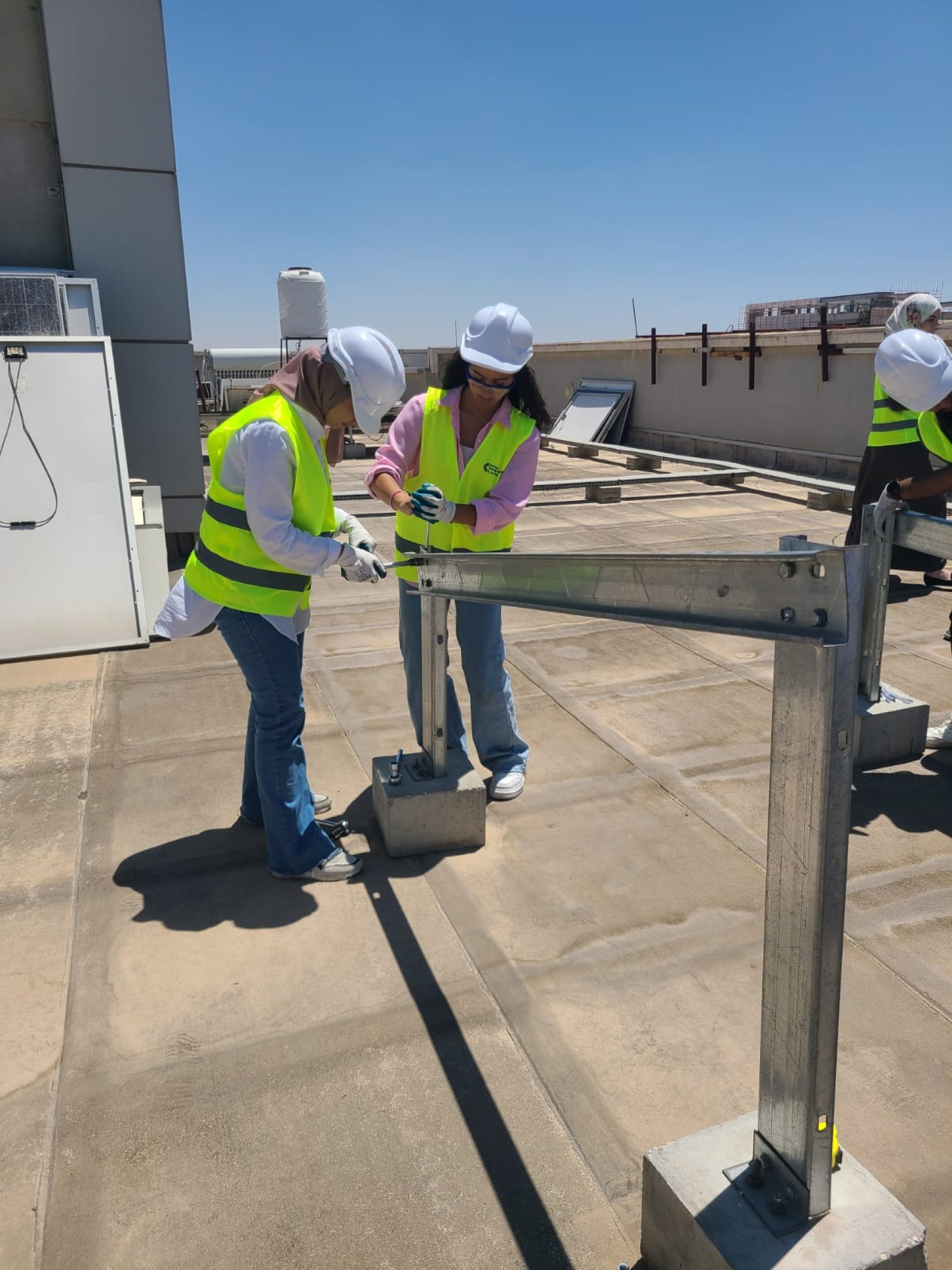 Women constructing solar panels
