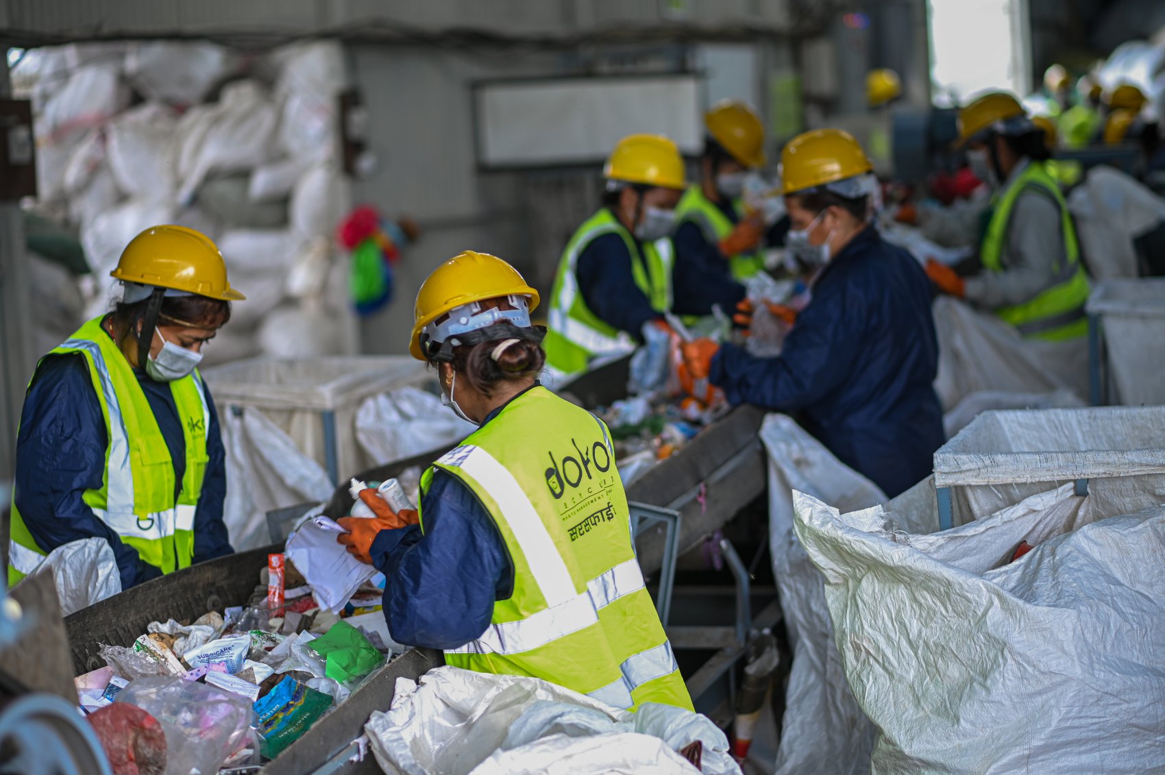 Workers in a waste management site