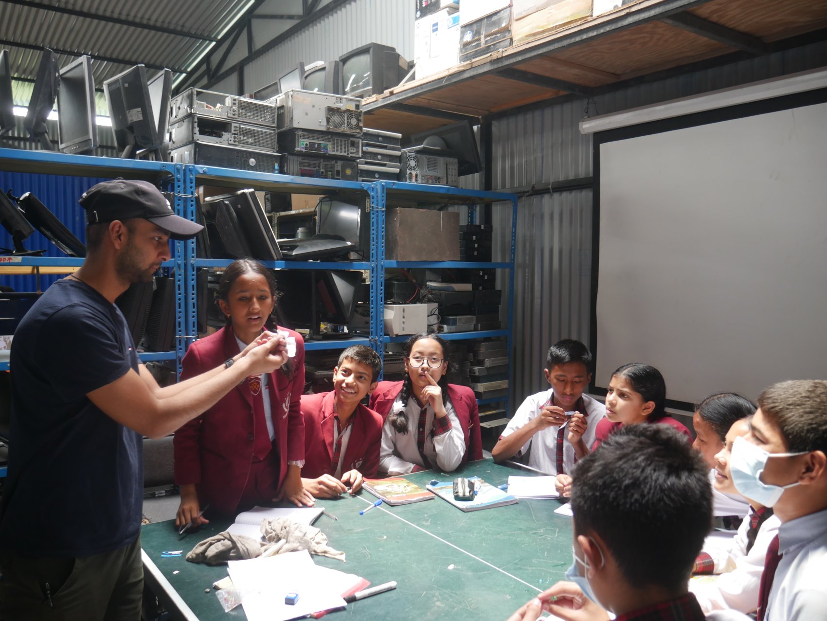 School children in an e-waste repair workshop