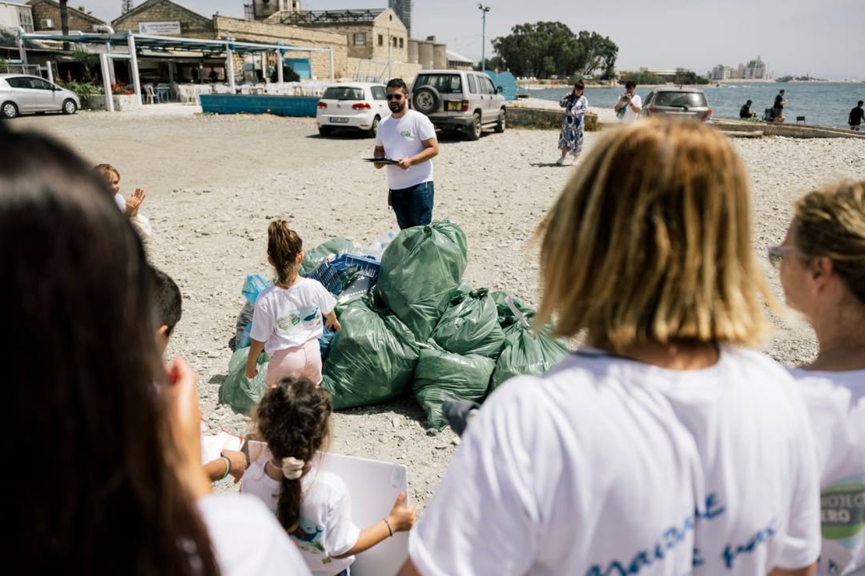 Teachers and learners on the beach for environmental lessons and beach cleaning