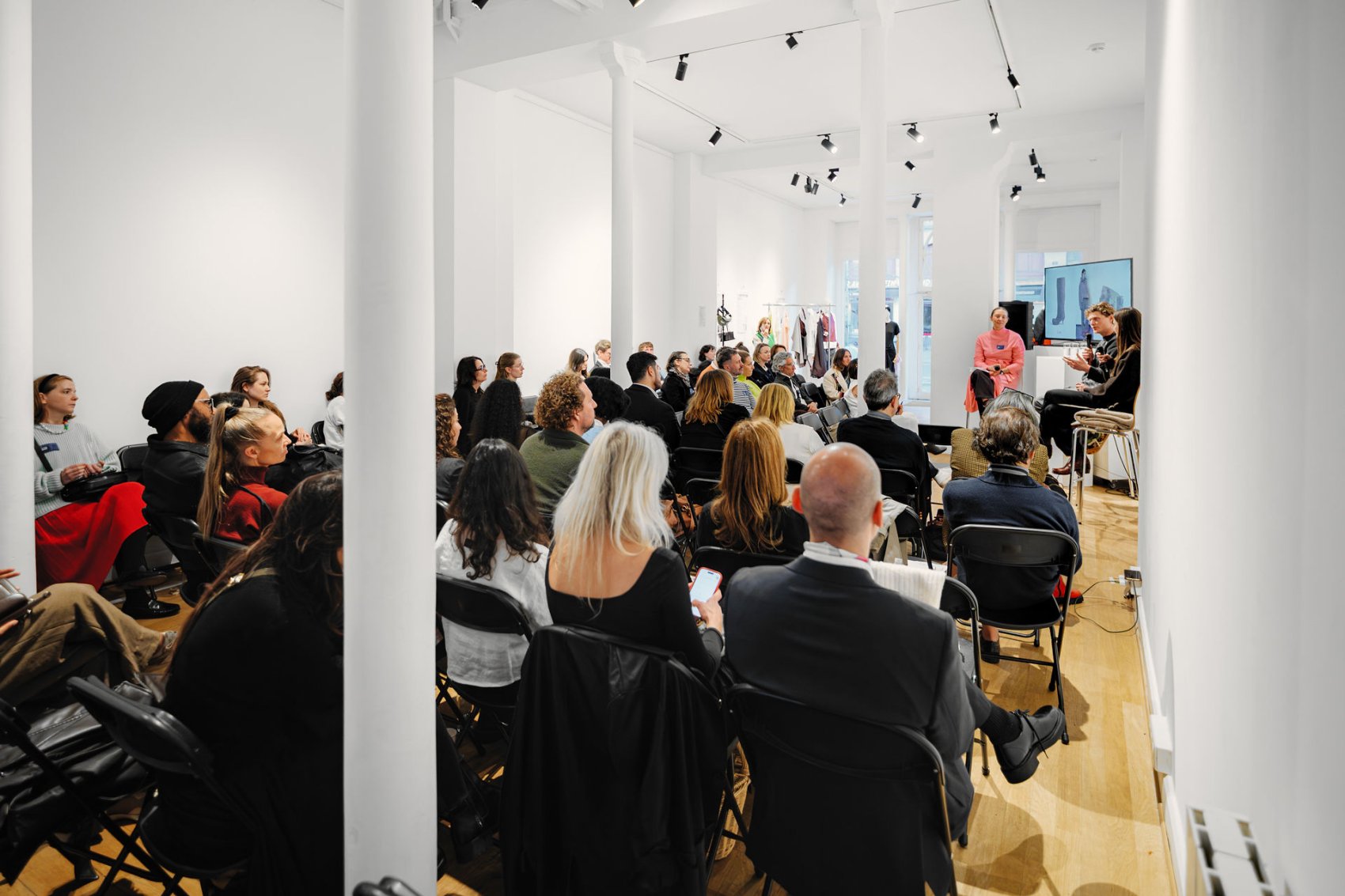 A group of designers at a presentation in a design studio